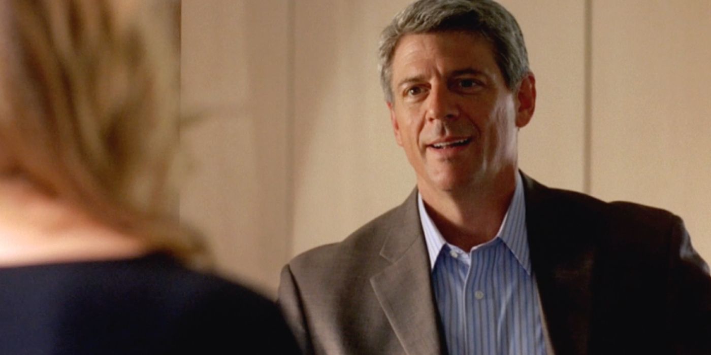Ted Beneke speaking with a woman